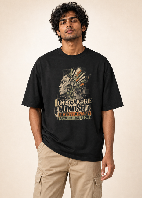 Male Indian model front hero wearing black UC22 Unbreakable Mindset relaxed T-shirt with large original front graphic