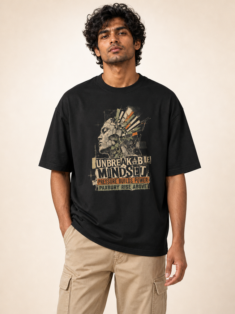 Male Indian model front hero wearing black UC22 Unbreakable Mindset relaxed T-shirt with large original front graphic
