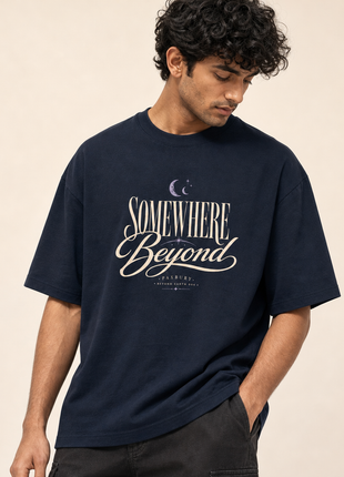 Indian male model on-body detail in PAXBURY Somewhere Beyond navy unisex UC22 T-shirt, roomy short sleeves, dropped shoulders and straight silhouette