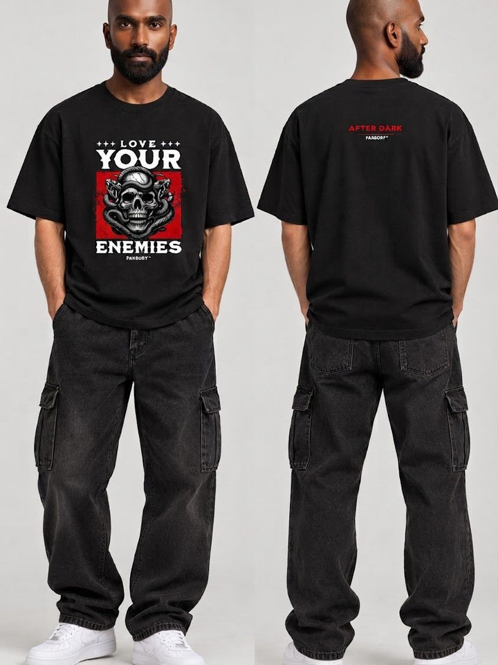 PAXBURY Love Your Enemies oversized black graphic T-shirt on Indian male model with shaved head and beard, front and back views
