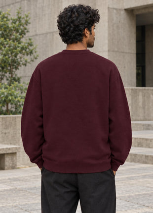 Indian male showing completely plain maroon back of Attendance 92% Attention 0% oversized UH35 sweatshirt
