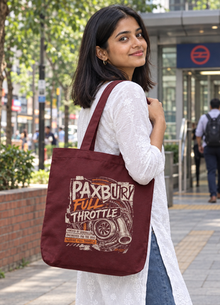 Maroon Full Throttle tote reverse side worn by young Indian woman outside a metro entrance
