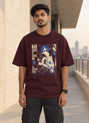 Kittl-created Indian male front view wearing PAXBURY Airplane Mode maroon UC22 oversized tee with compact aviation print