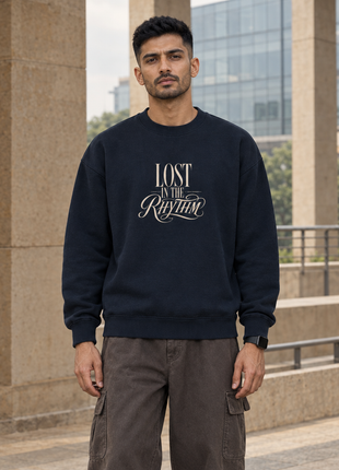 Kittl male-front editorial: PAXBURY Lost In the Rhythm navy oversized UH35 sweatshirt with compact cream front print