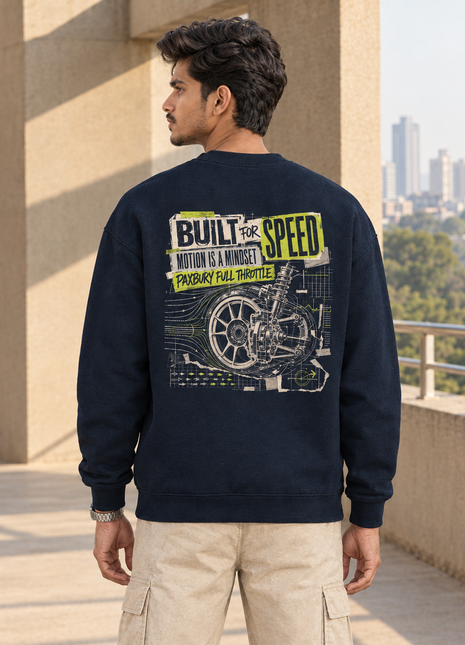 Matching Kittl Indian male back wearing navy Built for Speed UH35 oversized sweatshirt with lime-accented mechanical-wheel engineering graphic