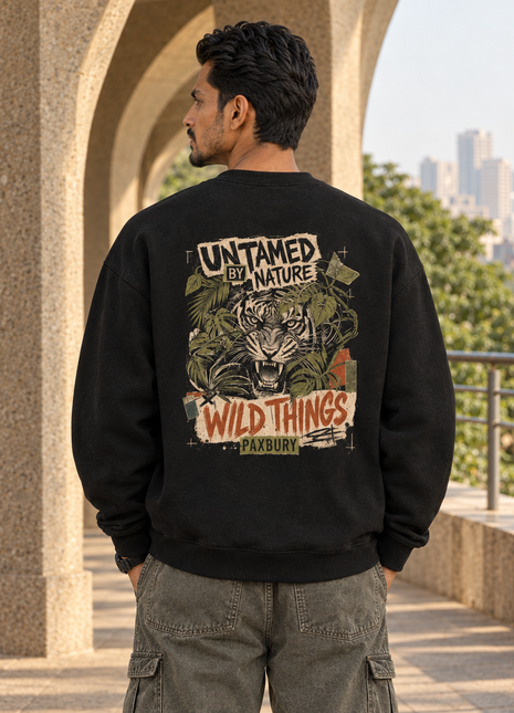 Matching Kittl male back editorial wearing PAXBURY Wild Things black UH35 sweatshirt showing original UNTAMED BY NATURE roaring tiger artwork