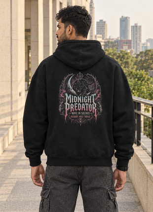 Same male model as front showing Midnight Predator black UH32 oversized hoodie with original large circular gothic back graphic