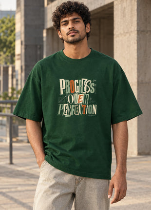 Rise Above Progress Over Perfection bottle-green UC22 oversized T-shirt on Indian male model, front graphic