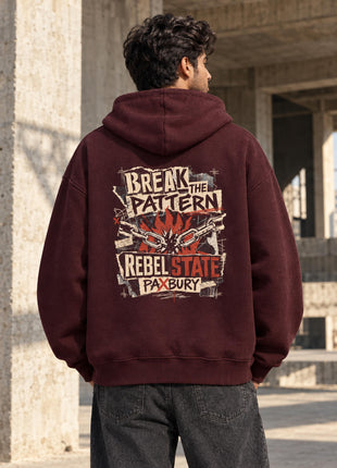 Indian male model in Rebel State maroon oversized hoodie with original-inspired BREAK THE PATTERN back artwork