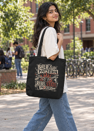 Young Indian female college student wearing PAXBURY Rebel State black tote on a leafy university campus