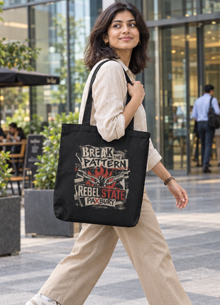 Indian young office-going woman carrying PAXBURY Rebel State black zippered tote outside a glass office building