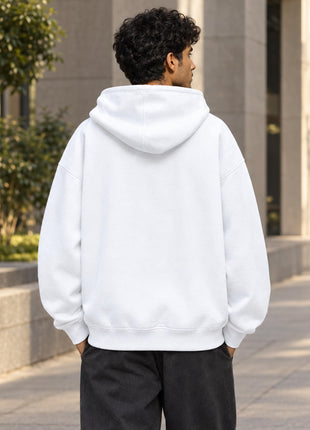Indian male model showing entirely plain, unprinted white back of Rebel State UH32 oversized hoodie