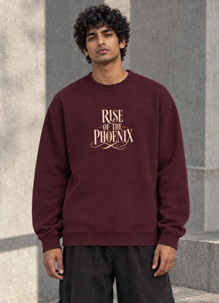 Indian male model wearing Rise of the Phoenix maroon oversized crewneck sweatshirt with cream front typography