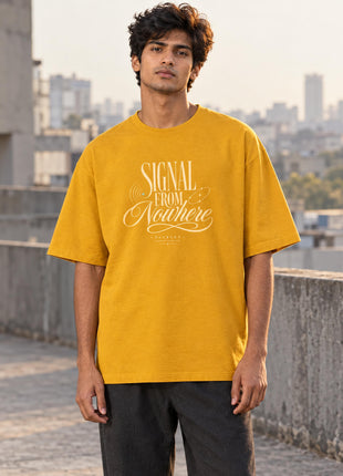 Indian male model in Signal From Nowhere golden yellow oversized T-shirt, cream SIGNAL FROM Nowhere lettering