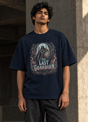 Indian male model wearing The Last Guardian navy oversized graphic T-shirt with accurate gothic illustration