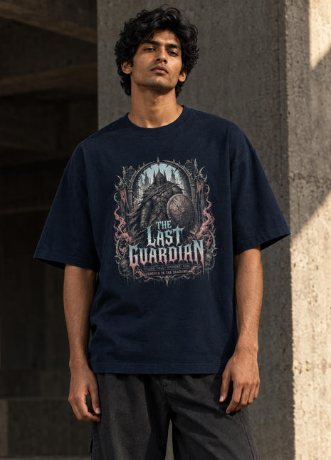 Indian male model wearing The Last Guardian navy oversized graphic T-shirt with accurate gothic illustration